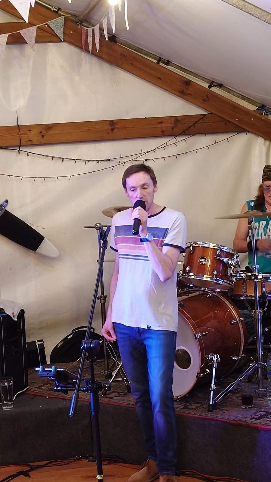 Gary singing on stage